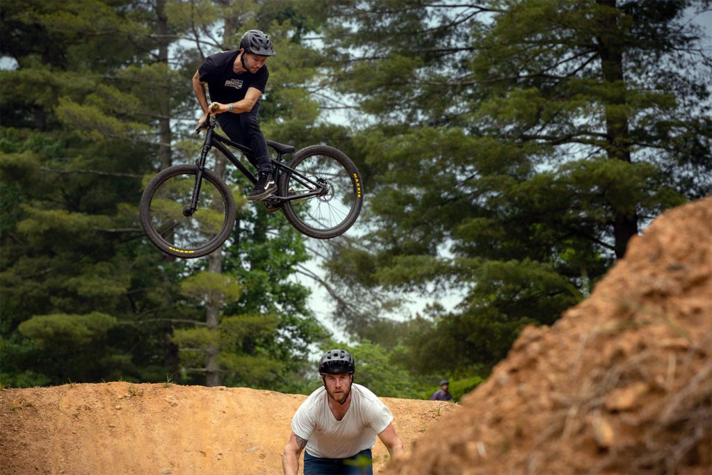 Rider doing a stunt on a bike with a Helm DJ fork