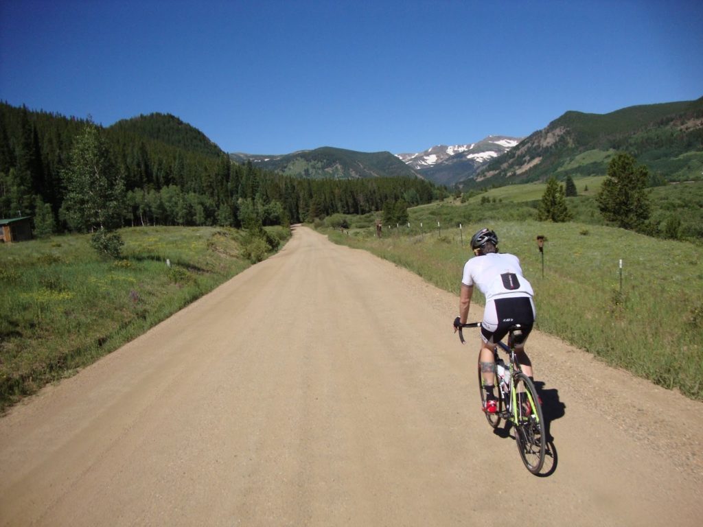 Kyle riding in scenic colorado valley